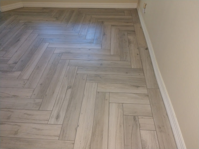 Gray tile flooring in herringbone pattern