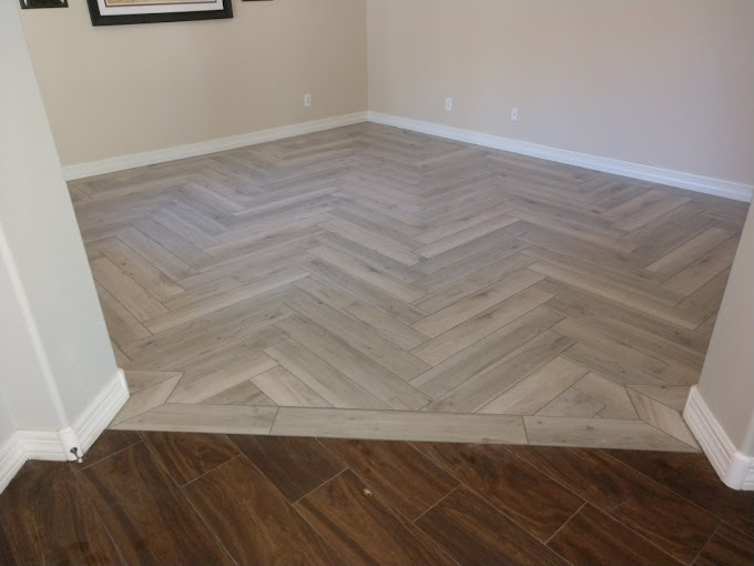 Herringbone tile meets dark brown wooden floor in home office