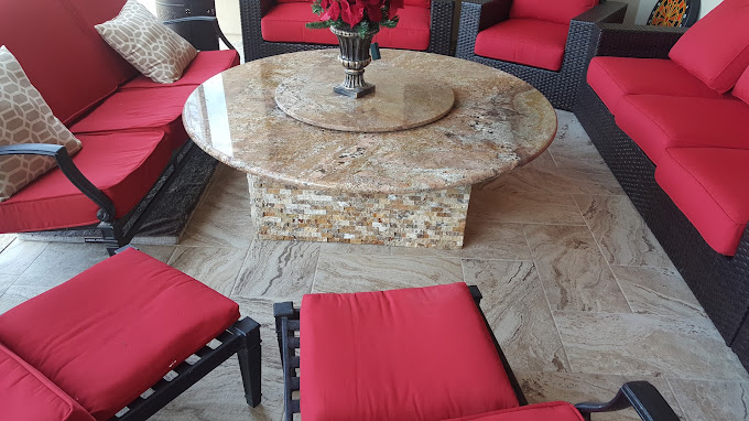 Outdoor patio custom granite table with tile stand and red patio lounge chairs